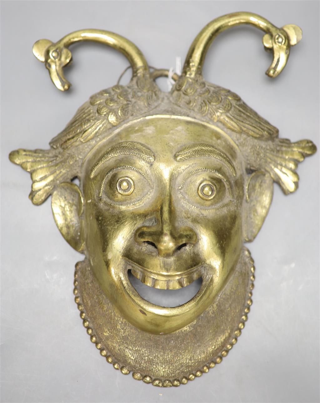 A gilt bronze wall mask, height 33cm